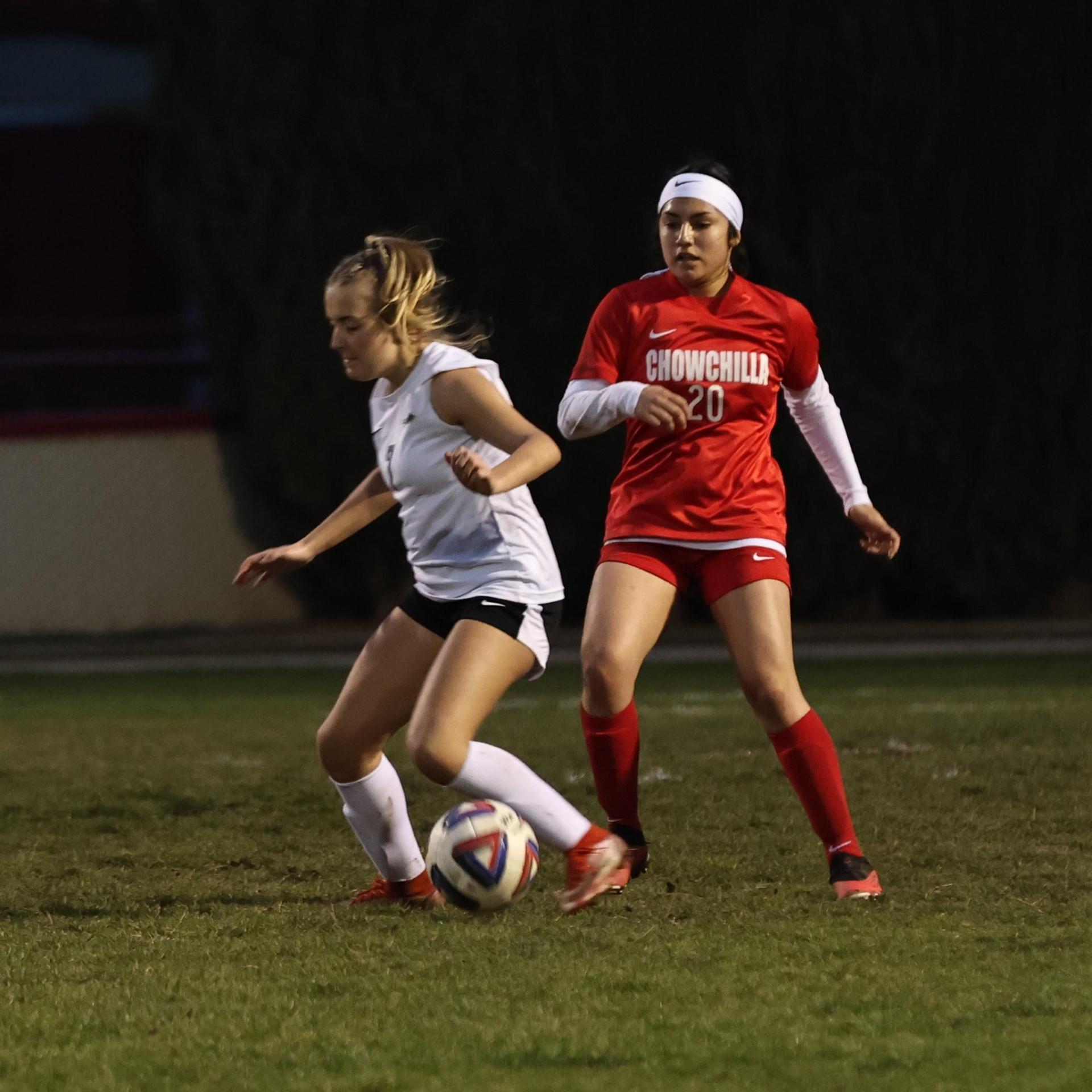 Junior varsity girls playing soccer against liberty