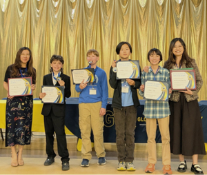 Students with their teachers holding Chinese Bridge certificates
