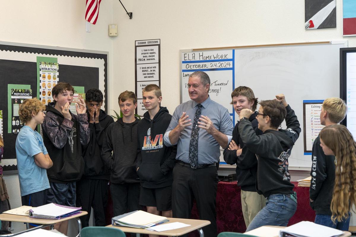 Principal Scott Nicotero with students