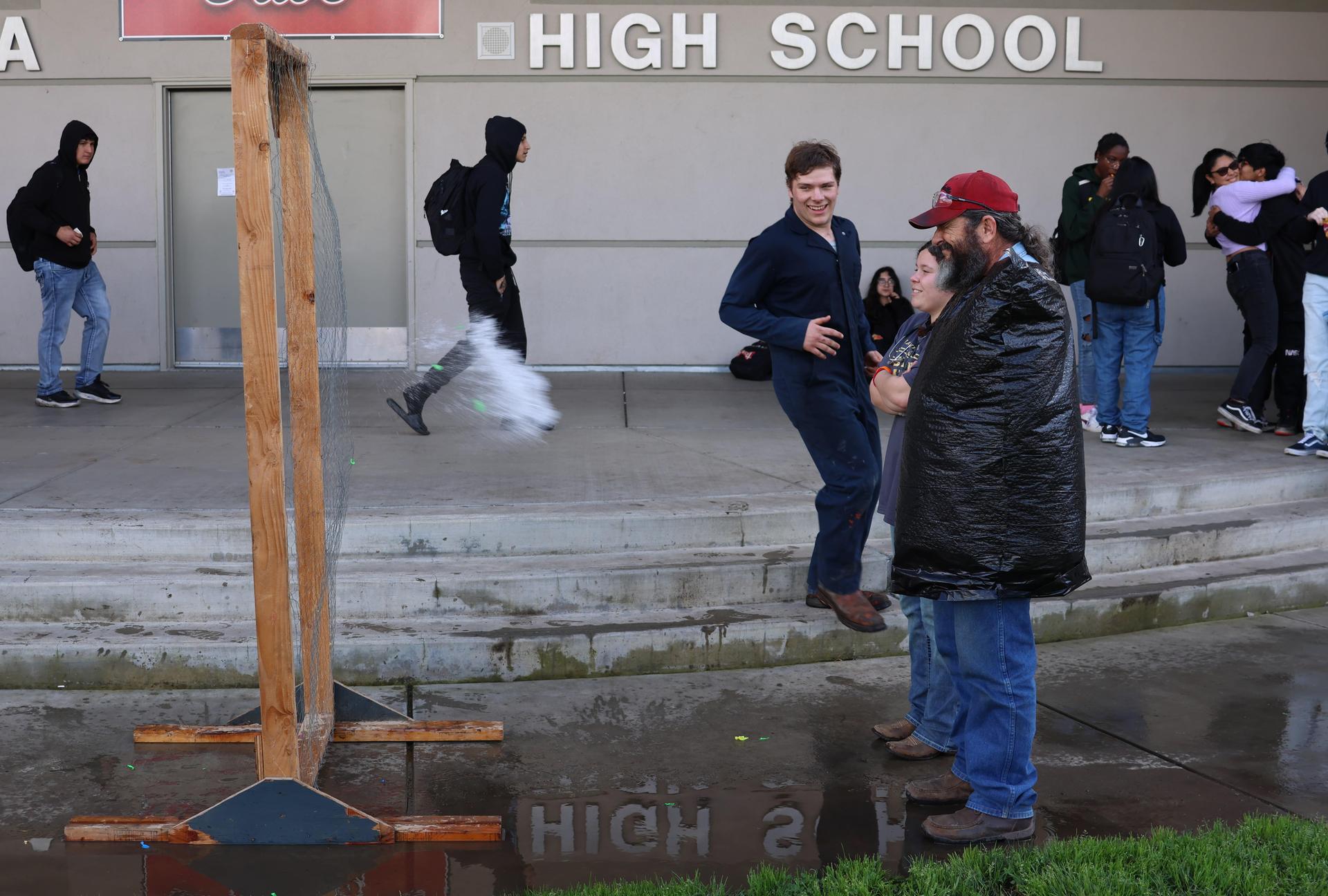 students and staff enjoying the water balloon toss