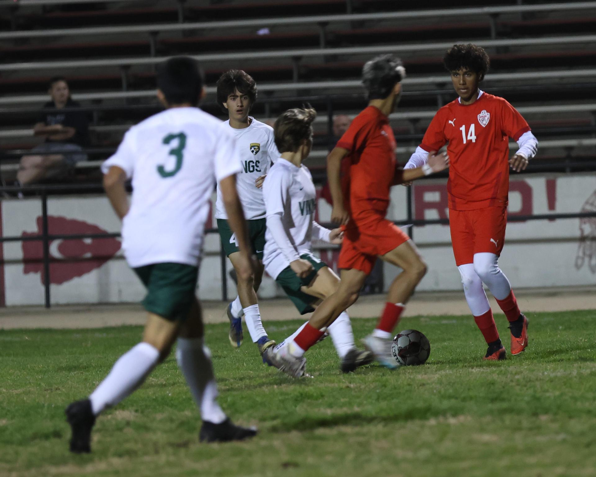 Varsity boys play soccer against Kingsburg