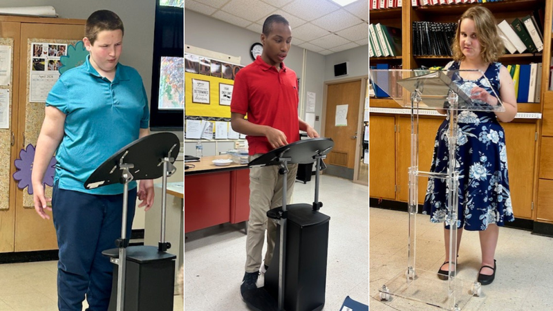 Students present at podiums and stands, practicing public speaking in a classroom setting.