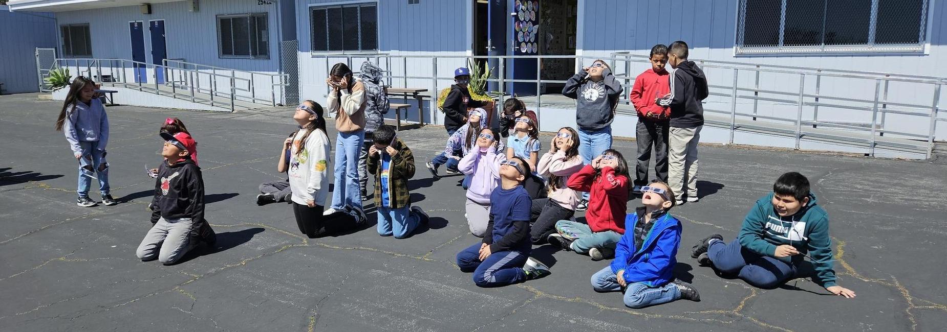 Herrick Students observing an eclipse