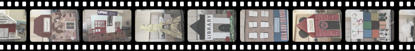 Film reel of card board buildings