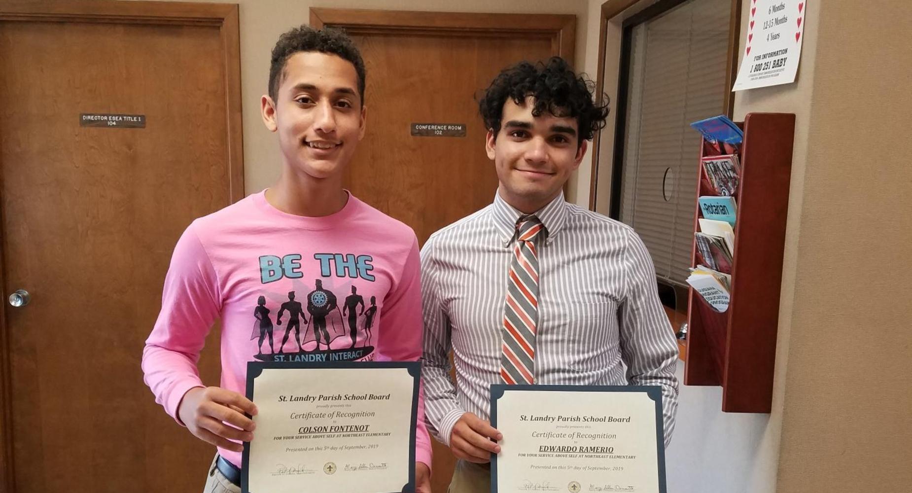 Colson Fontenot and Eddie Ramirez are recognized at the school board for