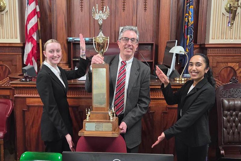 Captains Riley Joyce and Adithri Pingali with Mr. Steve Fulton, Attorney Coach