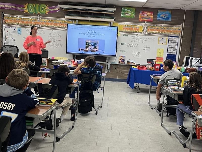 woman speaking to a classroom of students
