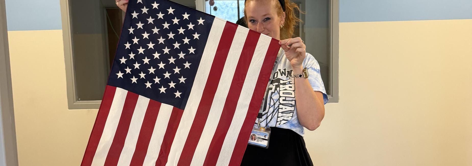 Miss Lavely Holding Flag