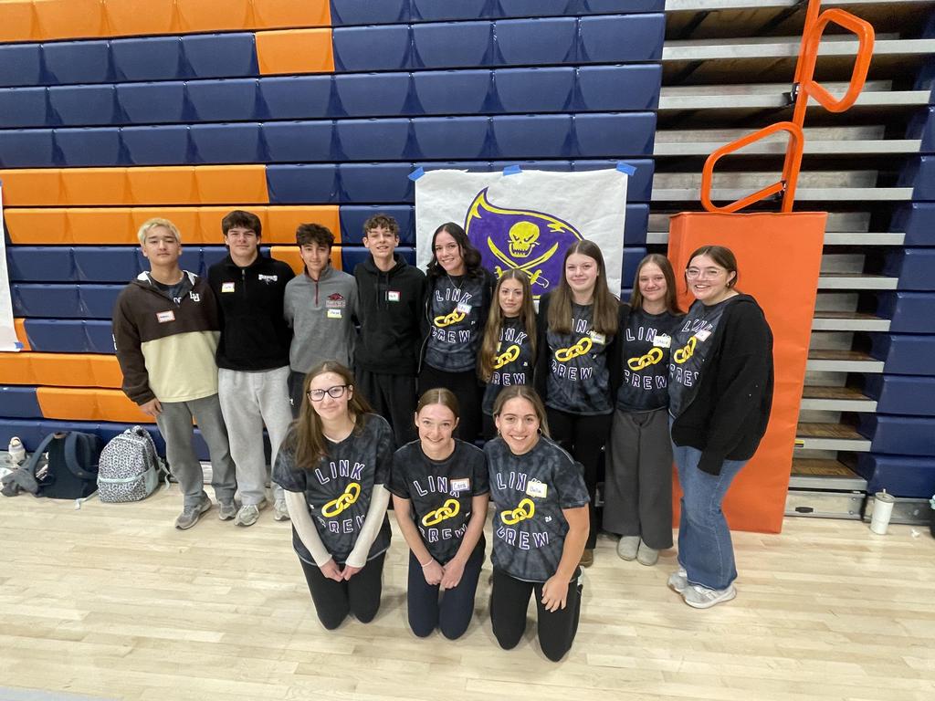 A group picture of the Link Crew in a high school gym.