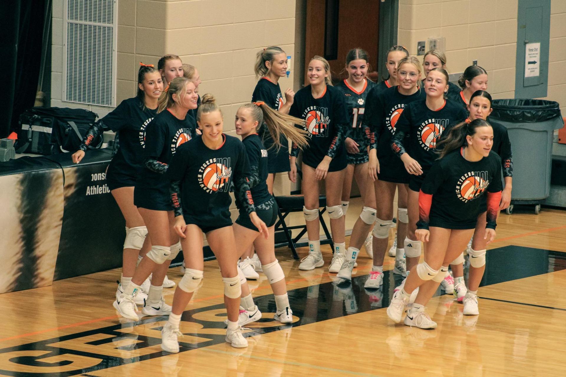 VB girls going out on the court