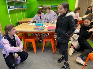 Fourth grade girls test their flying trapeze