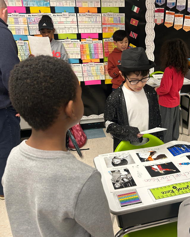 Student shows his poster of Michael Jackson