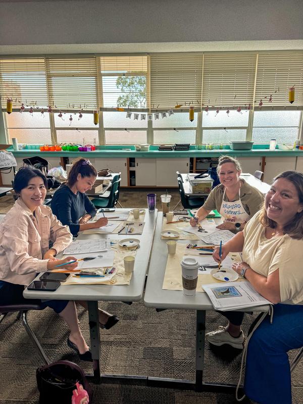 Four volunteers smiling