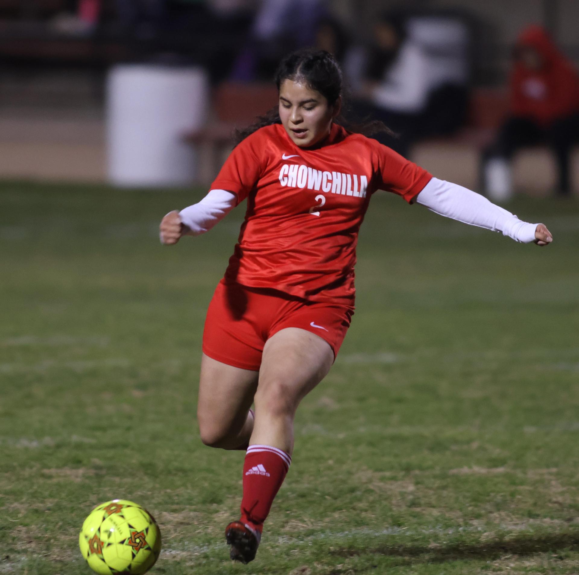 Varsity girls playing soccer against sunnyside