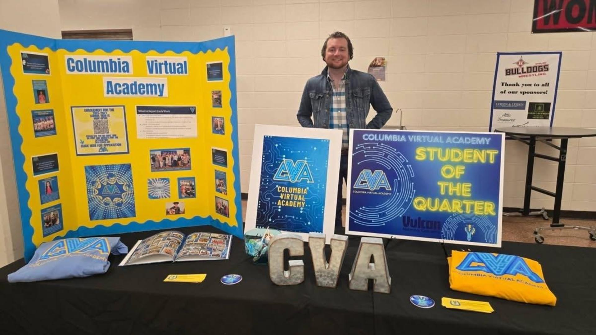 Display showcasing Columbia Virtual Academy with a smiling person.