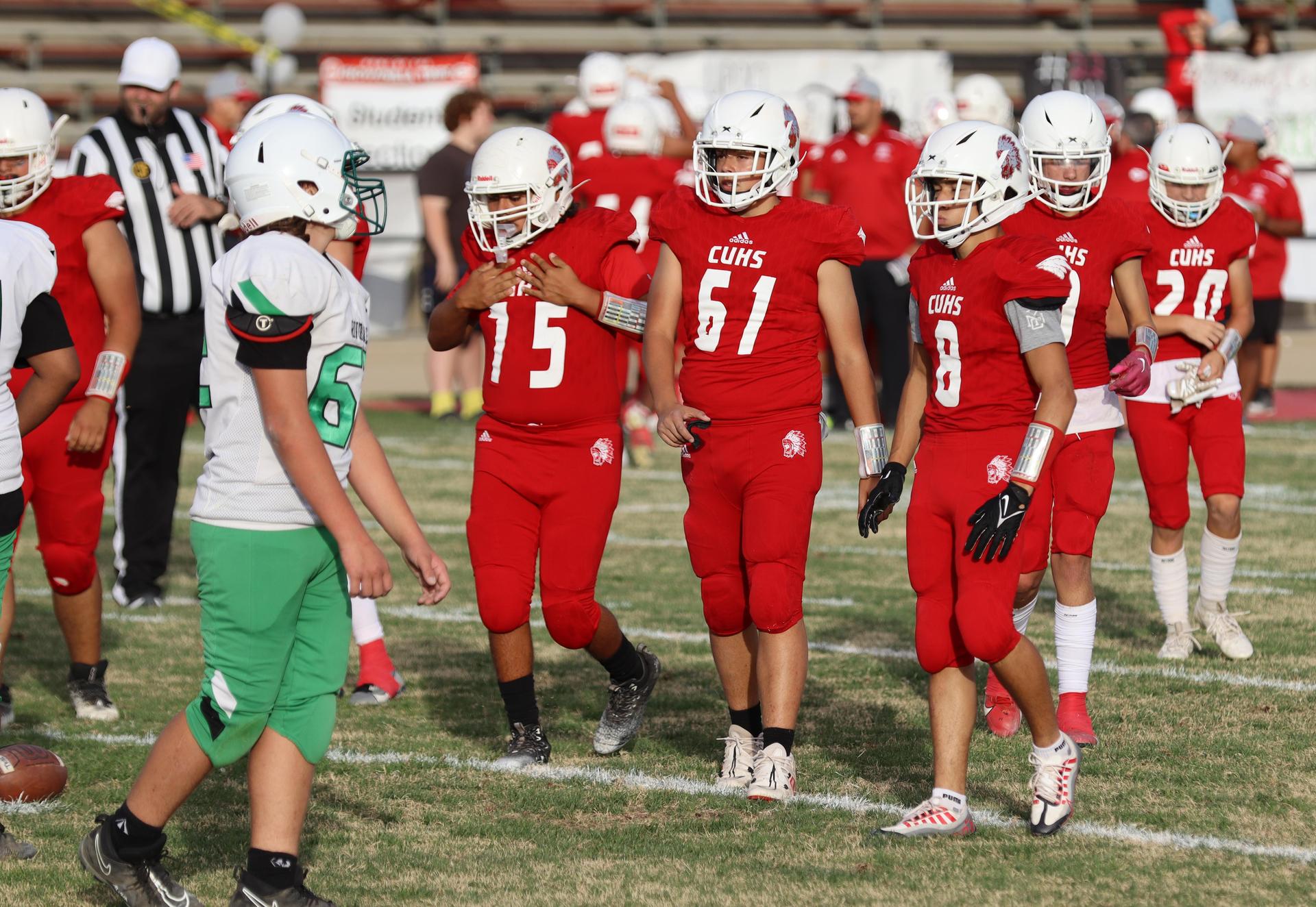  junior varsity football players in action against riverdale