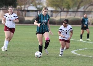 Student playing soccer