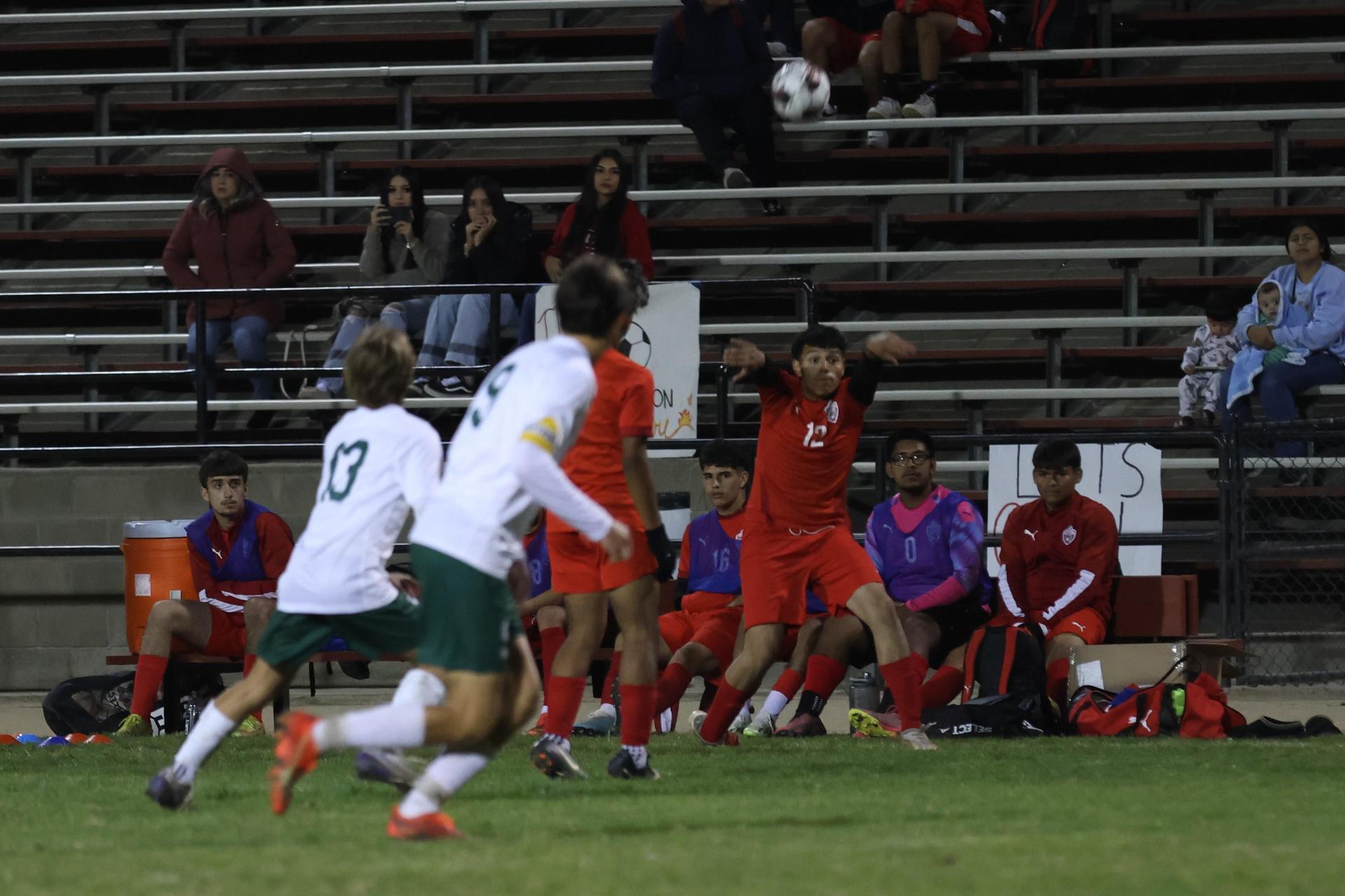 Varsity boys play soccer against Kingsburg