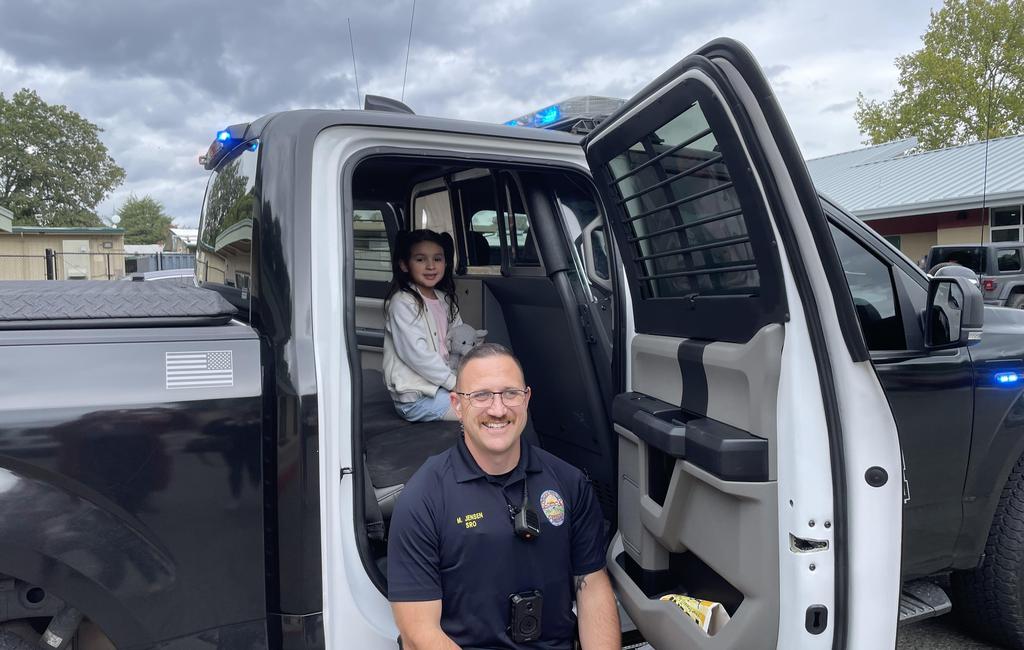 student in police truck