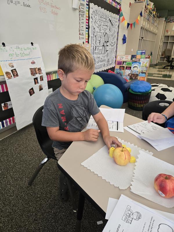 Students help find the prized apple