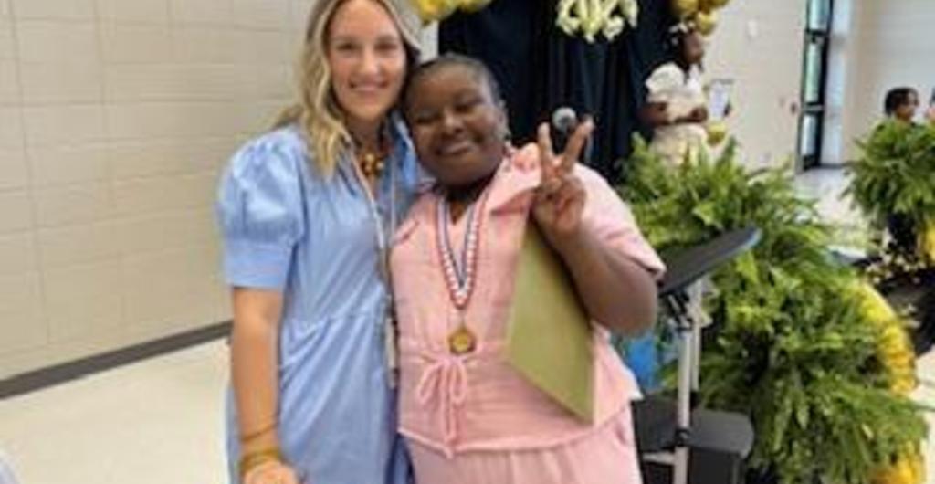 Teacher and student at honors day