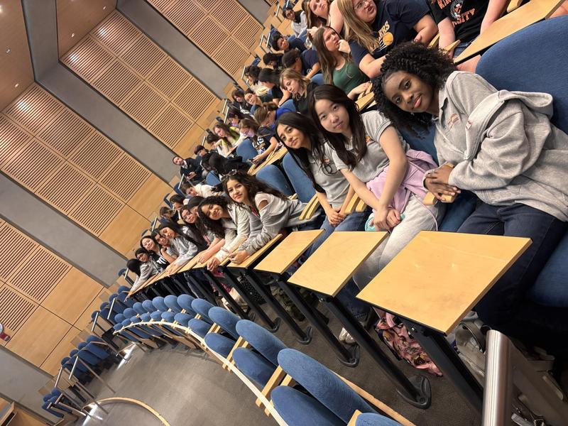 students sitting in desks at conference