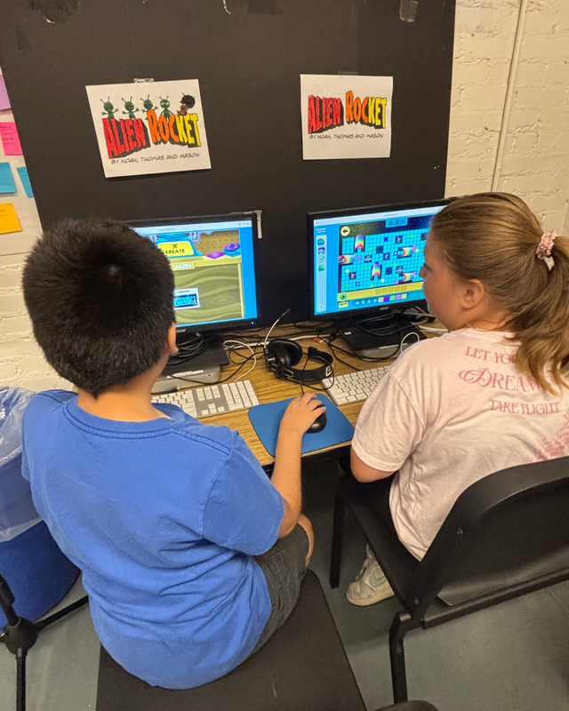 Students play a game coded by other students