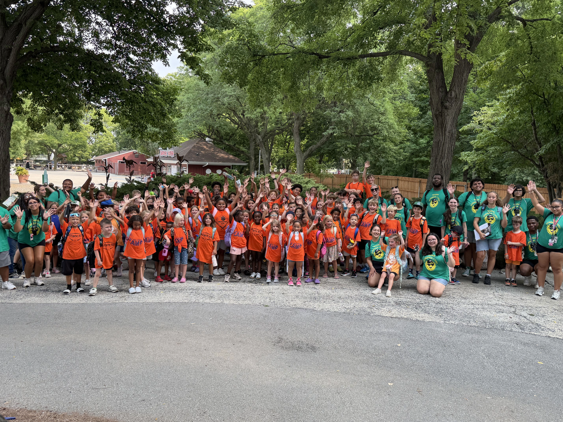  photo with kids outside with bright colors doing a color run at summer camp