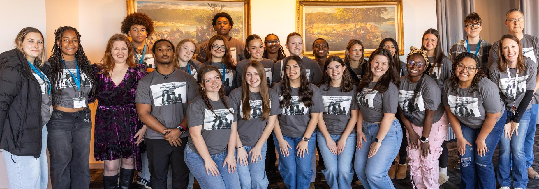 Student summit participants and teachers pose for a photo
