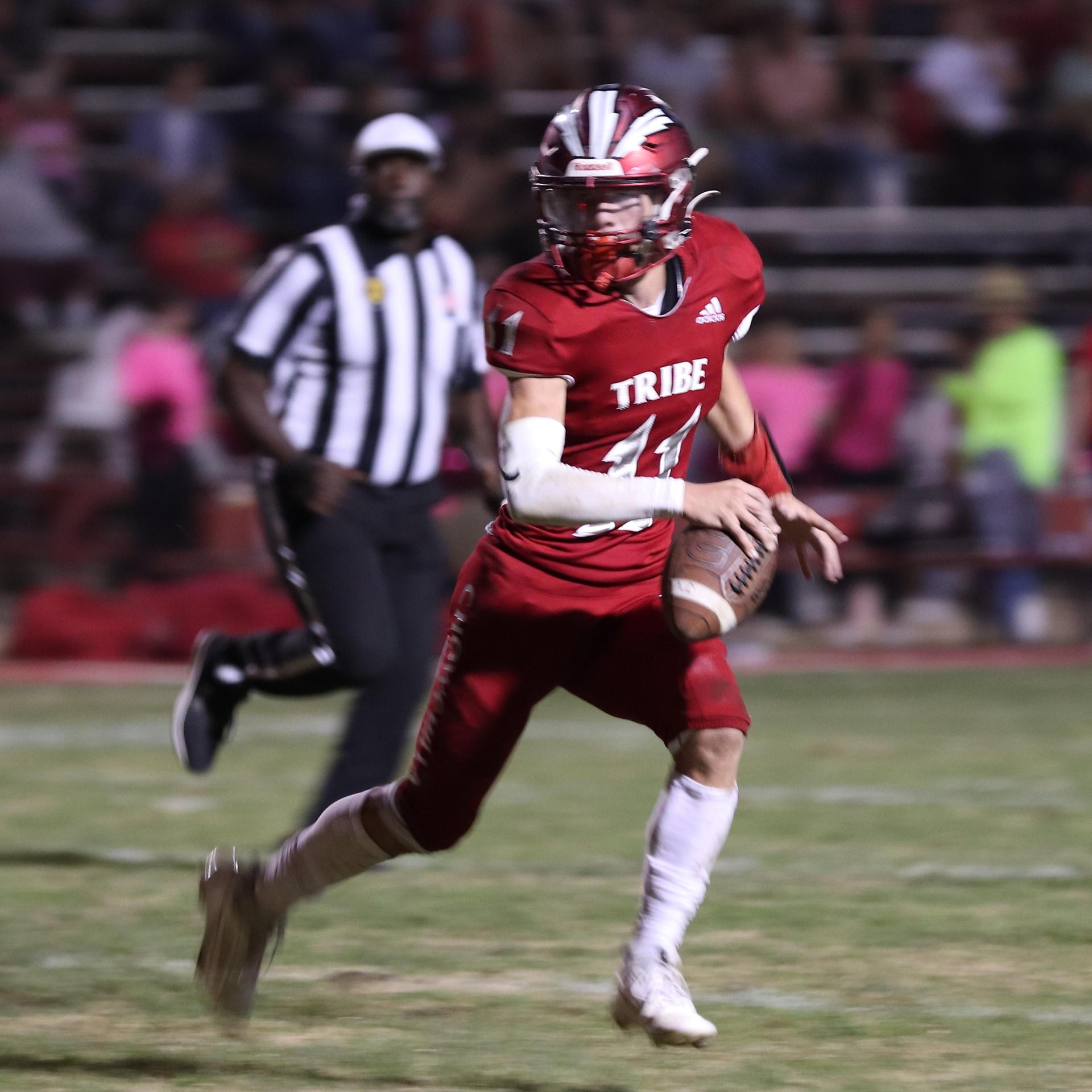 varsity boys playing football against Fowler