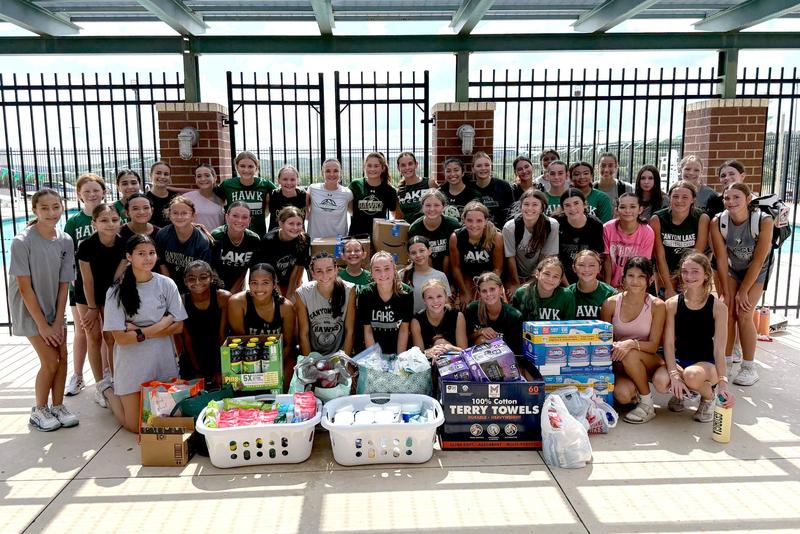 Canyon Lake High School softball team with donations for Kerrville