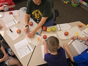 Students help find the prized apple