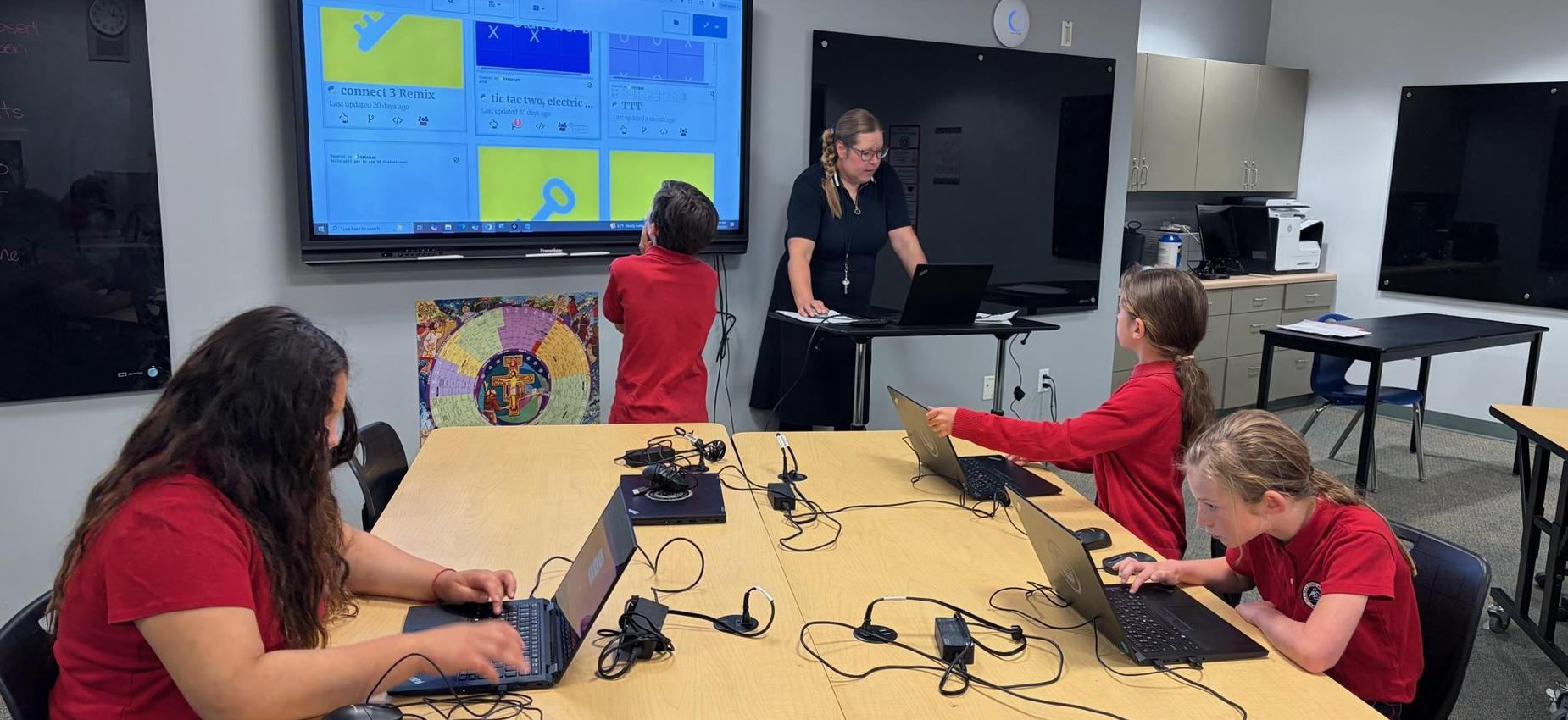 Third grade learns to code in technology class.