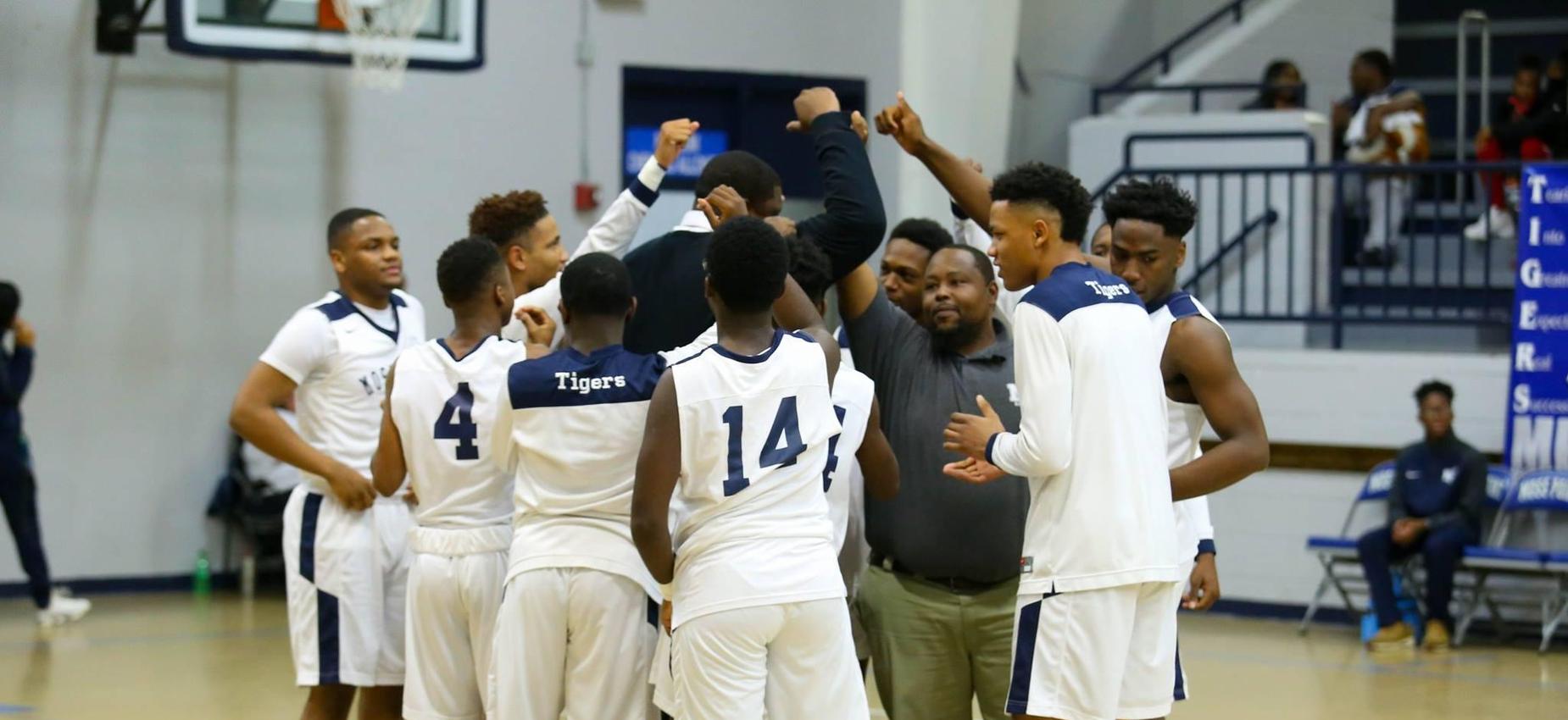 boys basketball group huddle