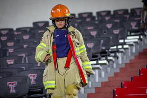 Mia Cordero participating in the fire academy 9/11 challenge