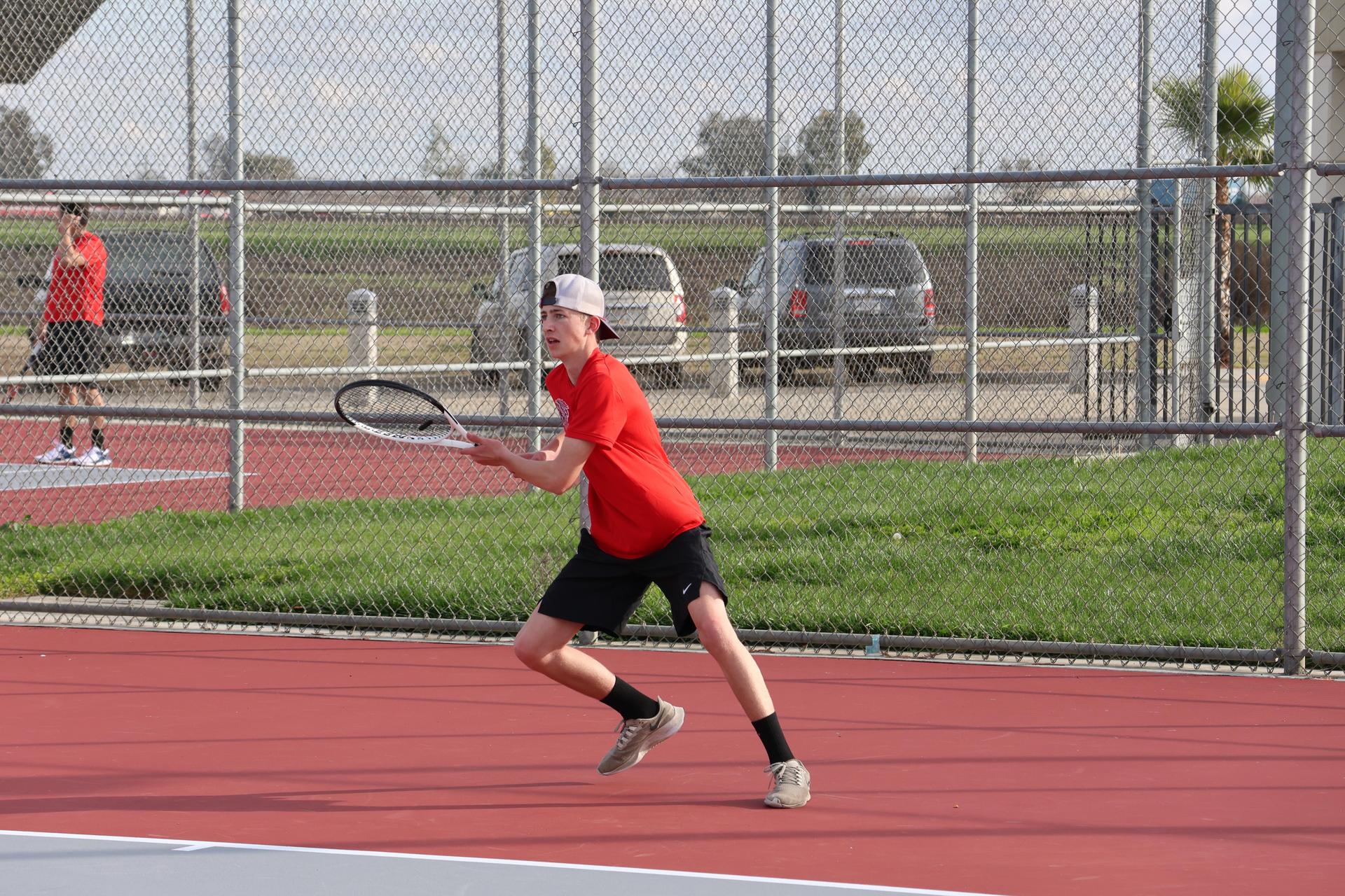 CUHS Boys playing tennis against coalinga