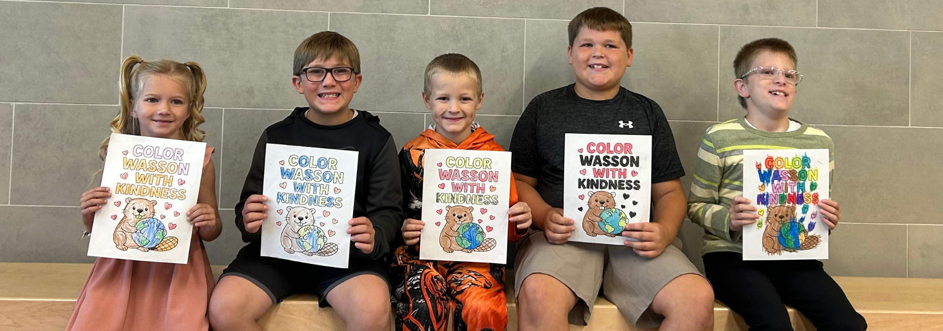 Five children holding coloring books titled 'Color Wasson with Kindness'.