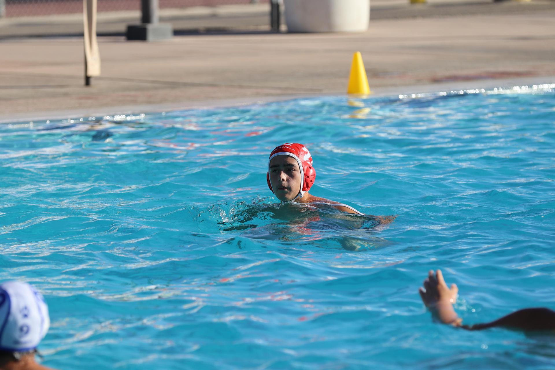 boys playing water polo against Madera