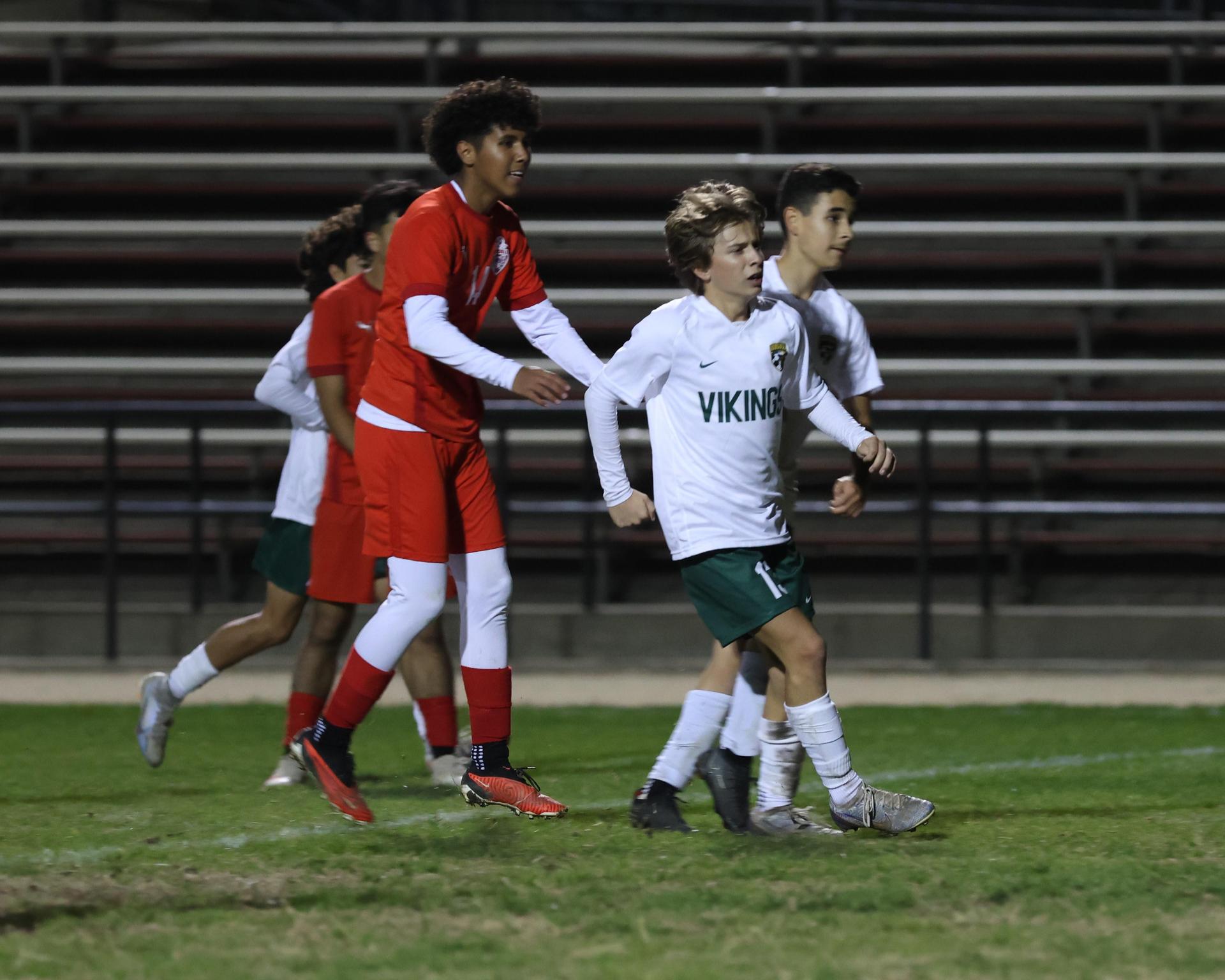 Varsity boys play soccer against Kingsburg