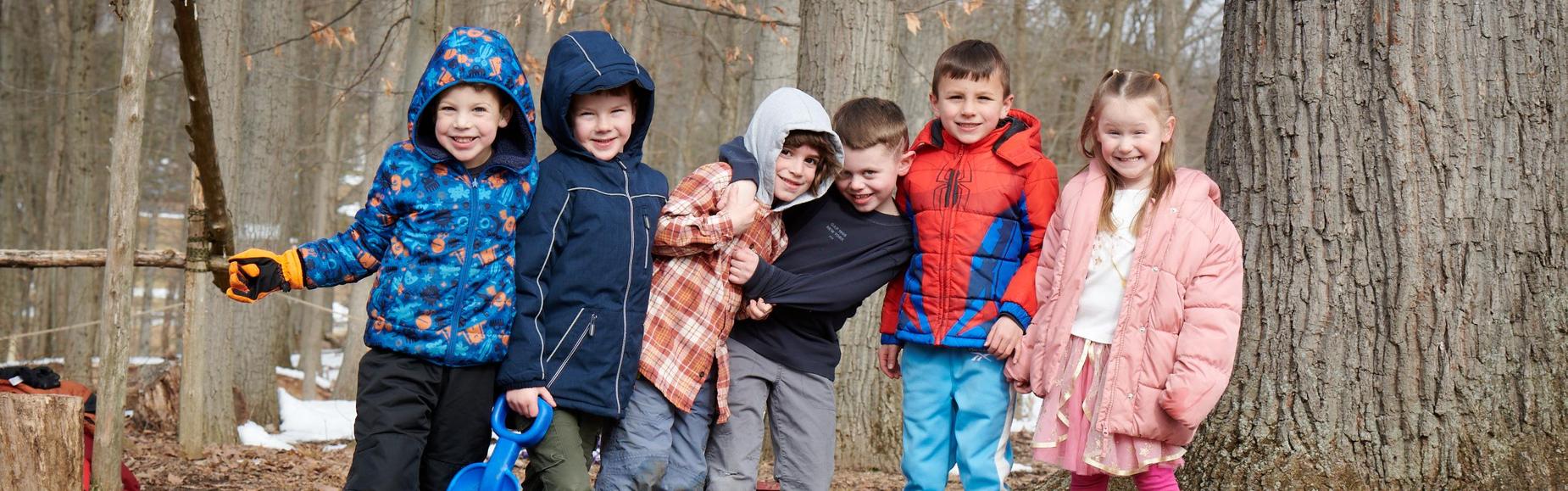 Lower school students climbing in the tree