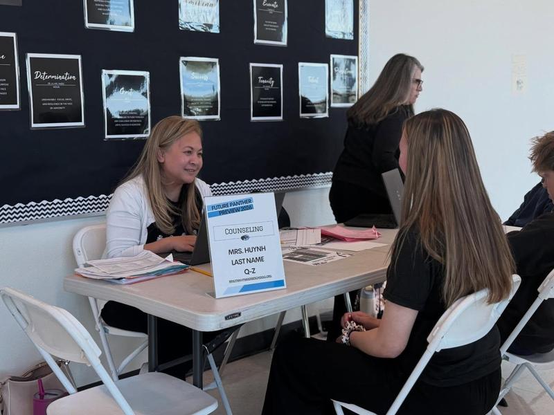 photo of counselor talking to student