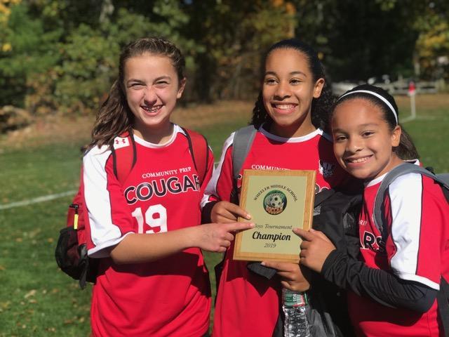 Students with soccer award