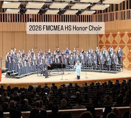 YHS Choir on stage at 2026 FMCMEA HS Choir Competition