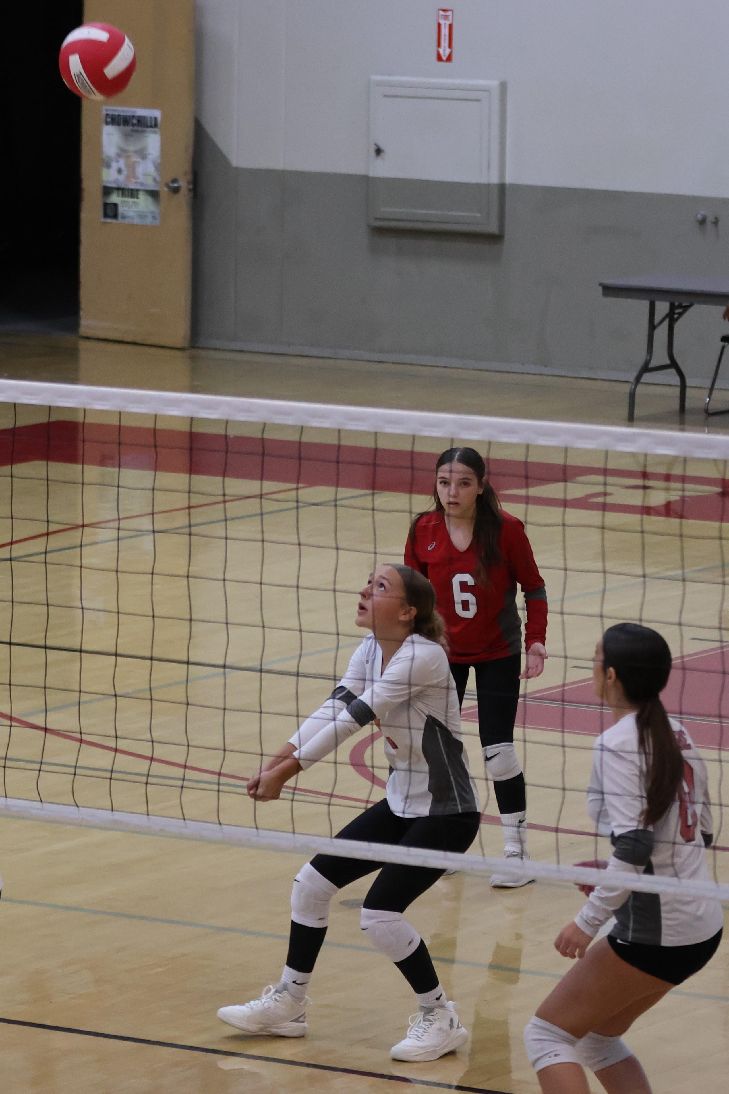 junior varsity girls playing volleyball 67