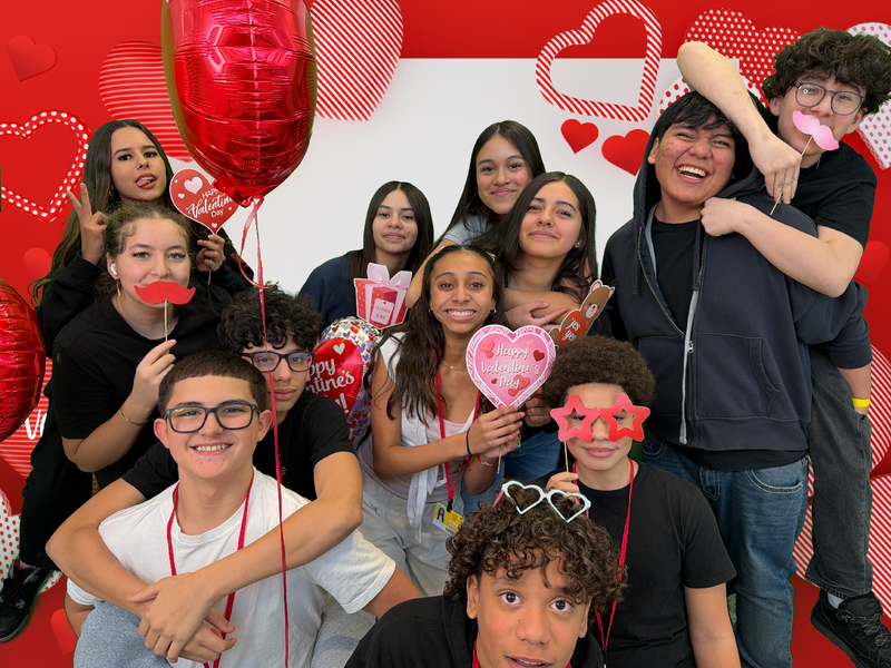 students in valentine's photo booth