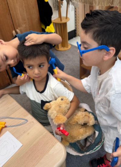 Three students playing doctor