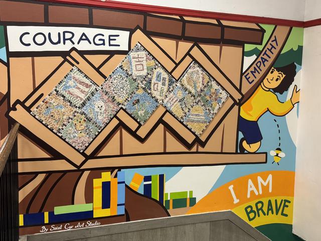 Mural depicting courage and empathy with playful art elements.