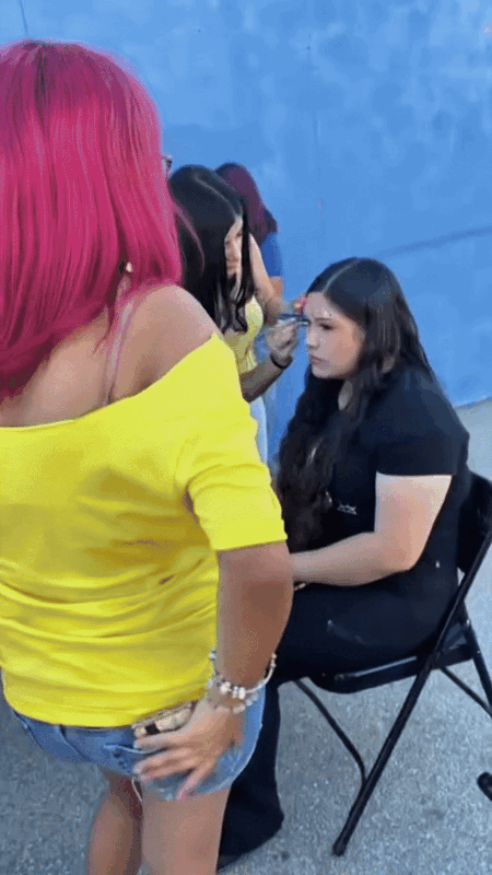 video of students face painting the principal and various community members
