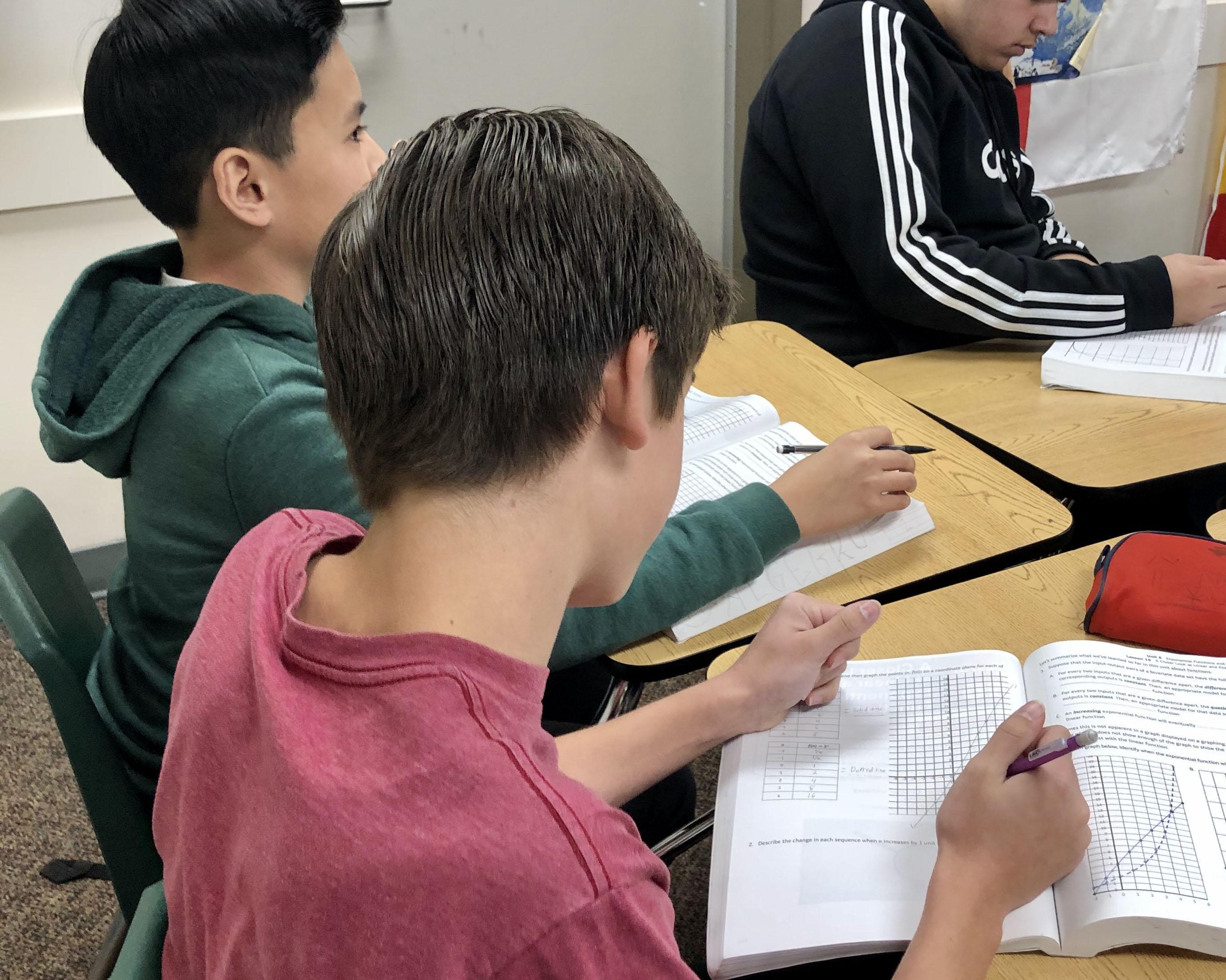 Students in a classroom all working on an assignment.