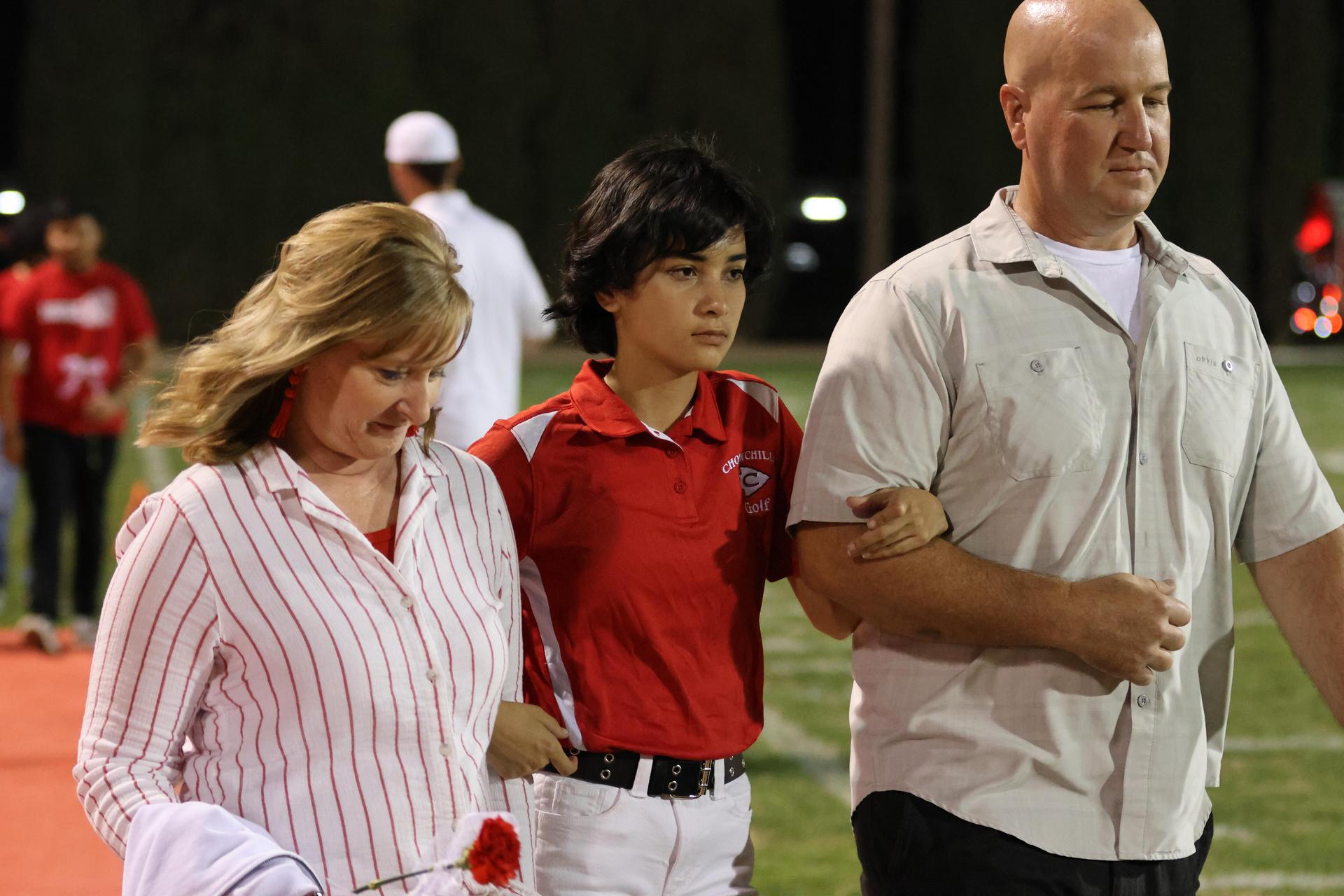 seniors and their escorts celebrating senior night